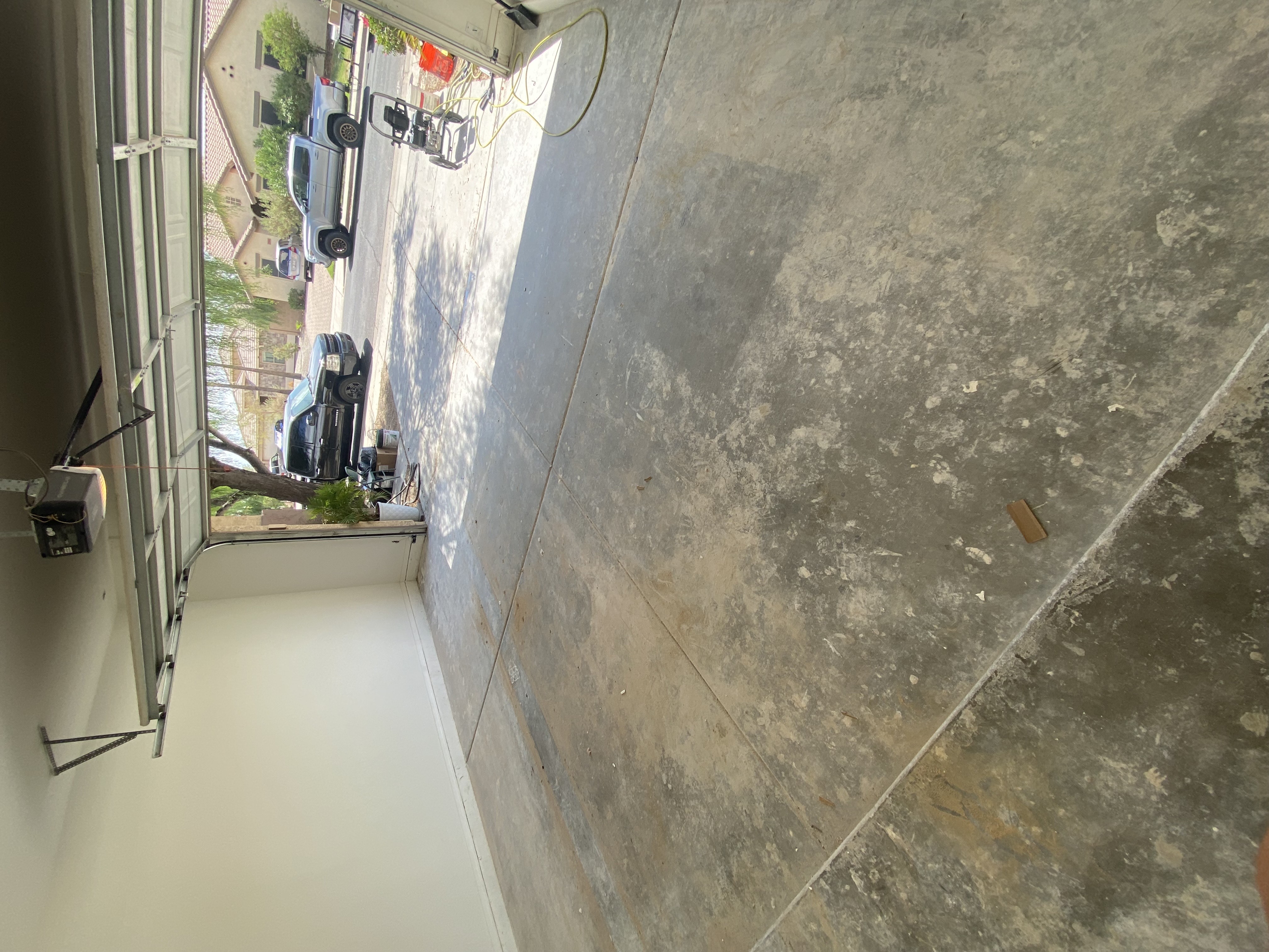 Driveway before pressure washing